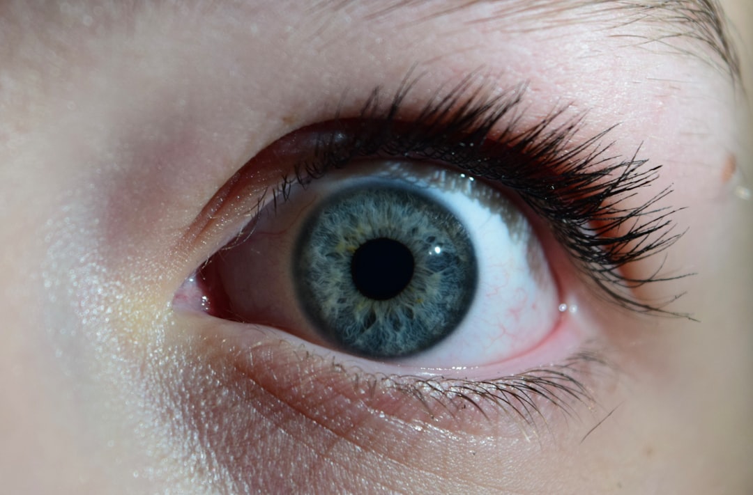 a close up of a person's blue eye