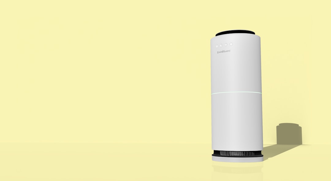 A white cylindrical object with a black top and bottom.