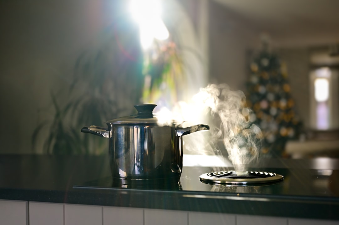 Steaming pot on stovetop with bright light