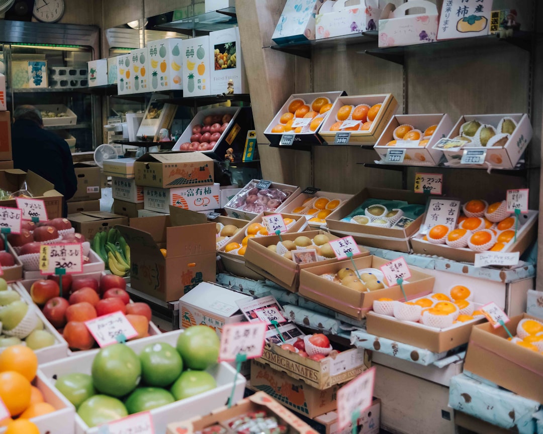 Fresh fruits are displayed in a japanese grocery store.