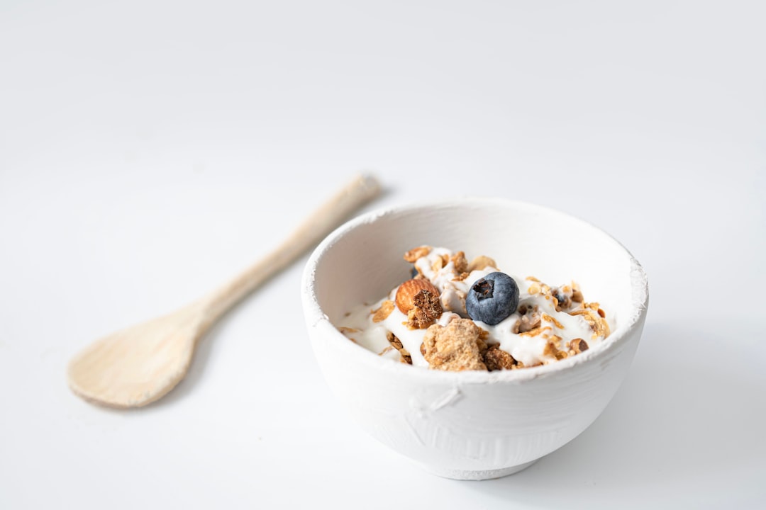 a bowl of cereal with a spoon on the side